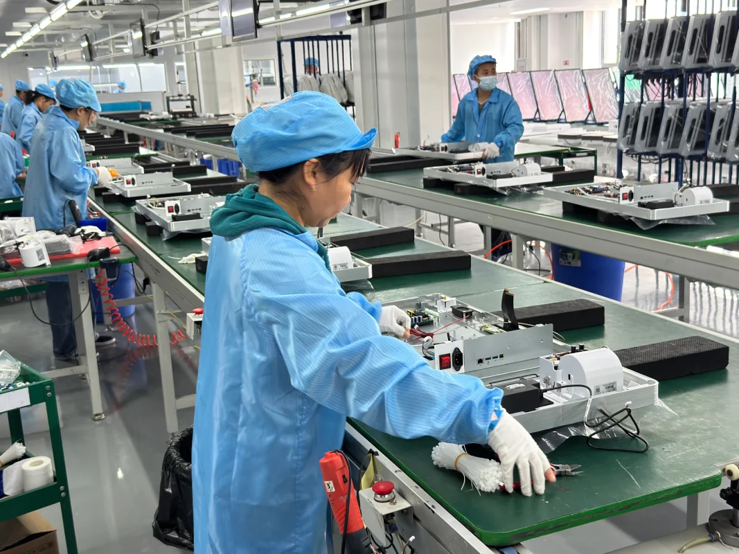 SUNTEK production assembly line with multiple workers